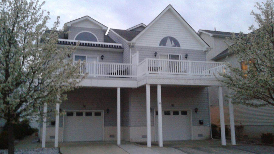 Blue and white house w steps and porch at NJ shore for rent