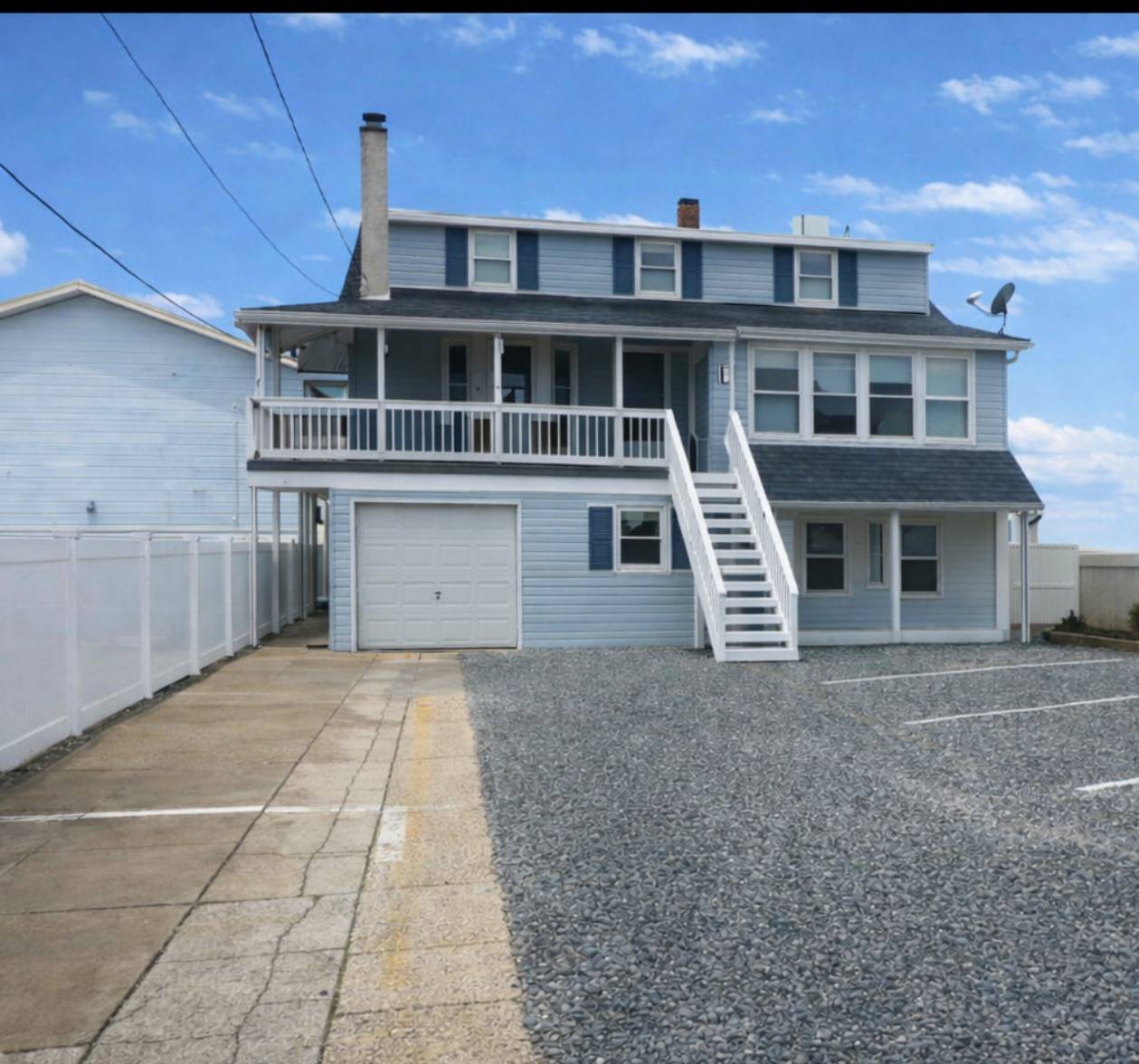 Blue and white house w steps and porch at NJ shore for rent